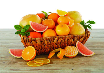 Rustic woven basket with grapefruit, oranges and tangerines.